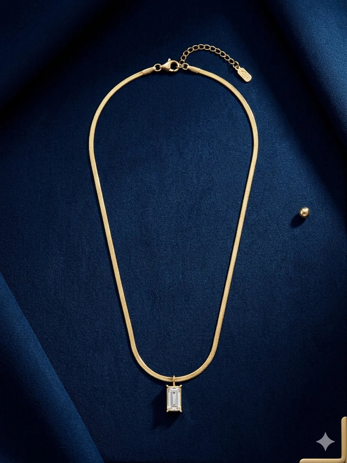 The Emerald-Cut Solitaire Herringbone Pendant